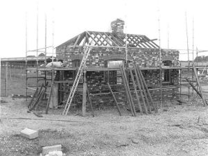The reconstruction of St Mary\'s Gatehouse by the gates at Swanwick. July 1987